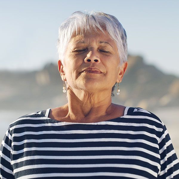 Woman breathing in deeply