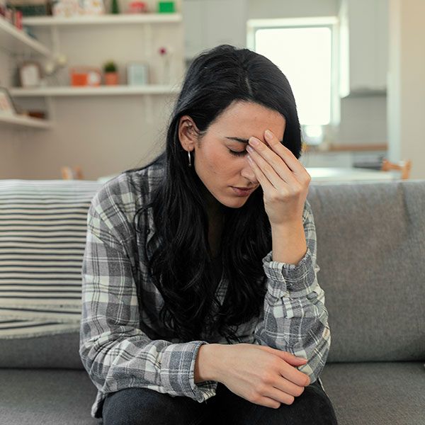 Woman experiencing vertigo